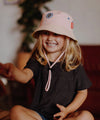 Bob enfant Mini Rosita Hello Hossy : chapeau tendance en coton, coloris rose et beige, idéal pour protéger les kids du soleil avec style et confort !