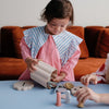 Boîte à formes en silicone Mushie avec disques colorés pour bébé