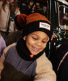 Bonnet enfant Hello Hossy Color Block Blacky marron et noir avec pompon