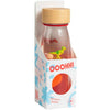 Bouteille sensorielle Petit Boum Move T-Rex avec liquide rouge et dinosaure flottant