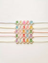 Bracelet enfant perles lettres BISOU fluo multicolore – Mini Galaxie