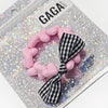 Bracelet enfant rose avec perles cœur et nœud vichy noir et blanc – Gaga