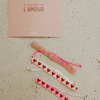 Bracelet perlé cœur rose Atelier Wagram sur carte cadeau – bijou amour à offrir