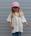 Casquette enfant et maman Mini Gummy Hello Hossy : coloris rose vif et détails ludiques, éco-responsable et tendance. Parfaite pour un look fun et assorti !