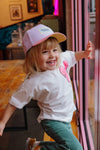 Casquette enfant Mini Purply Hello Hossy : design coloré en violet et rose, tendance et éco-responsable. Idéale pour un look fun et stylé au quotidien.