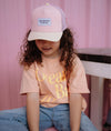 Casquette enfant Powder Pink Hello Hossy : design tendance en rose poudré et beige avec filet respirant. Confortable et stylée, idéale pour un look estival !