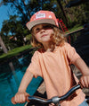 Casquette enfant Hello Hossy Peachy Bloom corail motif fleurs – accessoire enfant été tendance concept store famille