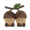 Peluche glands mignons avec visages souriants et feuille sur la tête