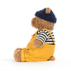 Peluche ours marin Bartholomew Jellycat avec salopette jaune et bonnet bleu