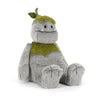 Peluche monstre gris avec détails verts et feuille style créature nature