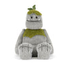 Peluche monstre gris avec détails verts et feuille style créature nature